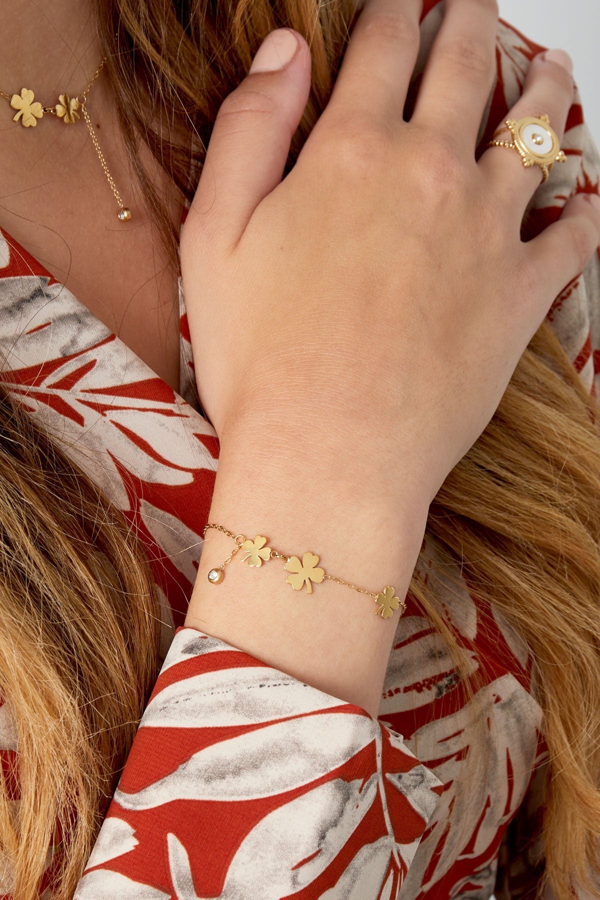 Armband drie klavers en steen - Goud kleur