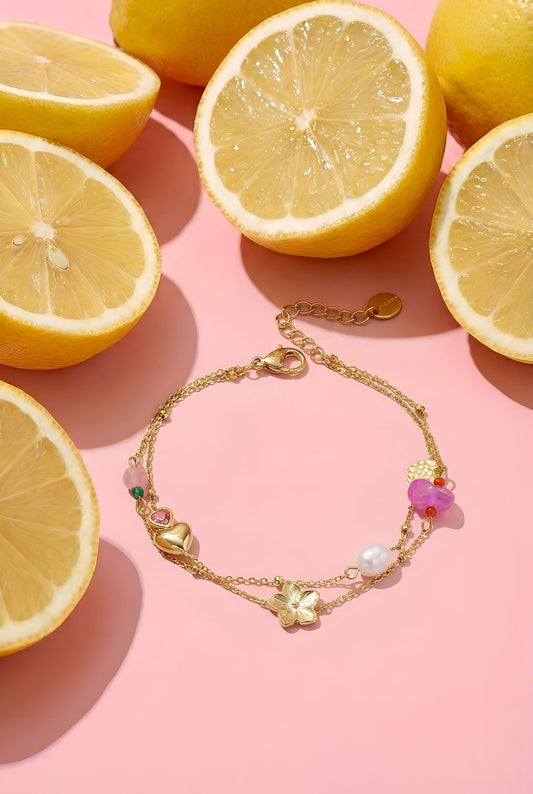 Bedelarmband met hart bloem en parel