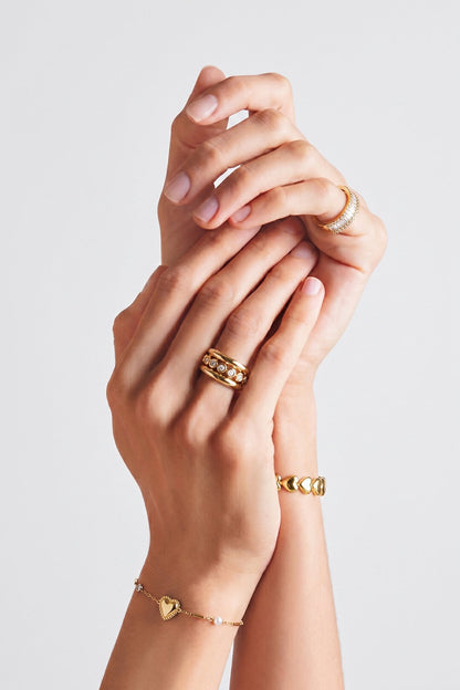 Drievoudige ring met steentjes -goud