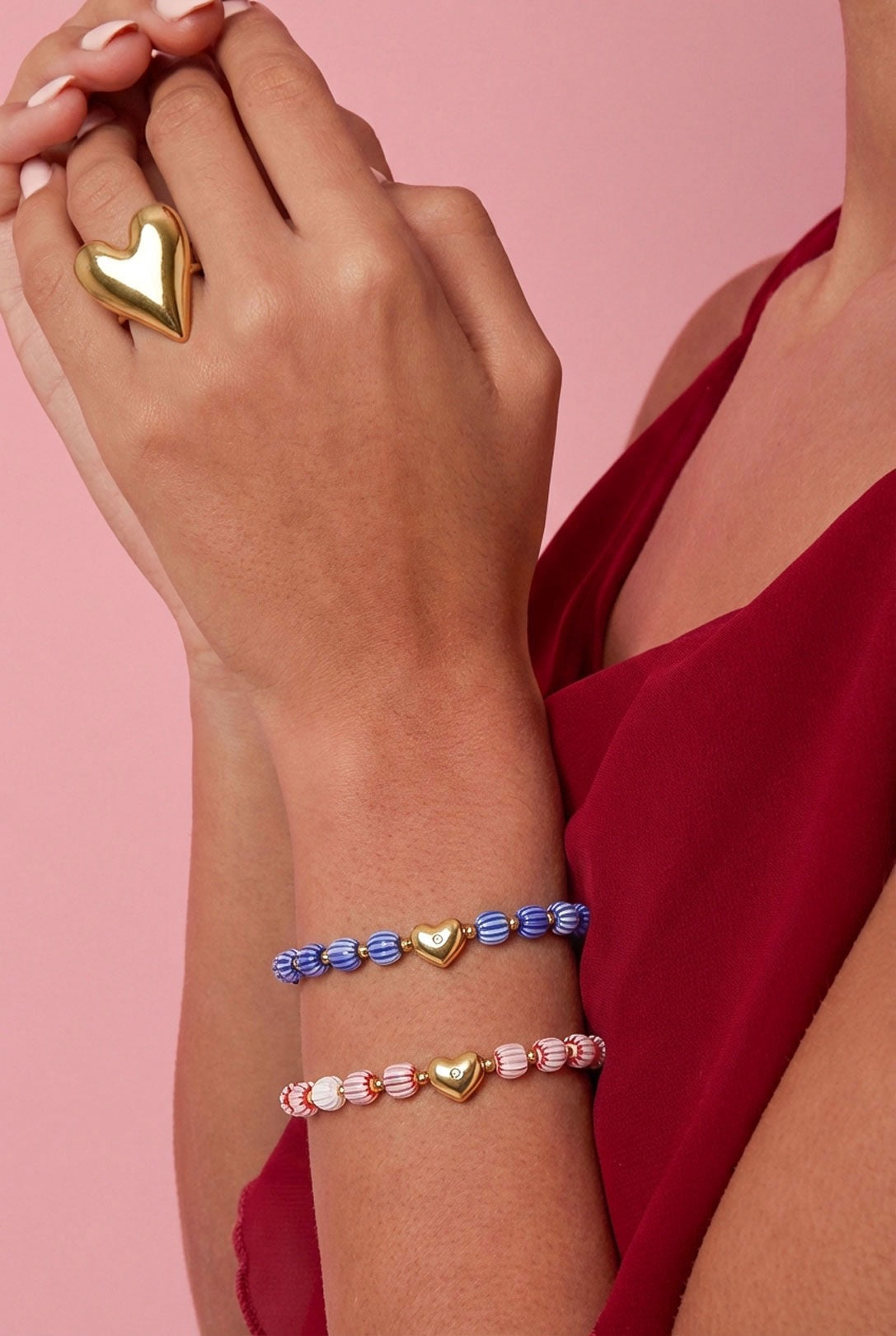 Armband van kralen met hartvormig centerpiece -roze