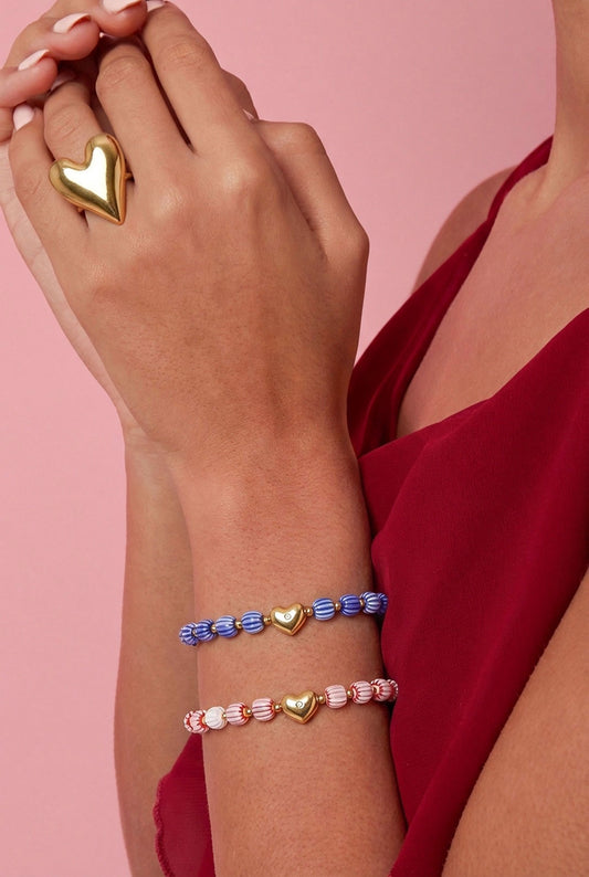 Armband van kralen met hartvormig centerpiece -roze